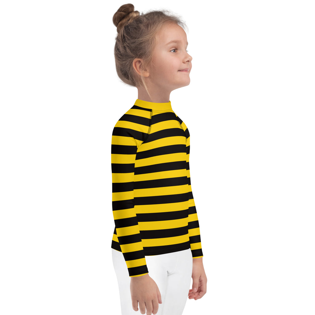 A child wearing a kids bumblebee stripes long sleeve rash guard swim shirt with UPF 50+ in yellow and black