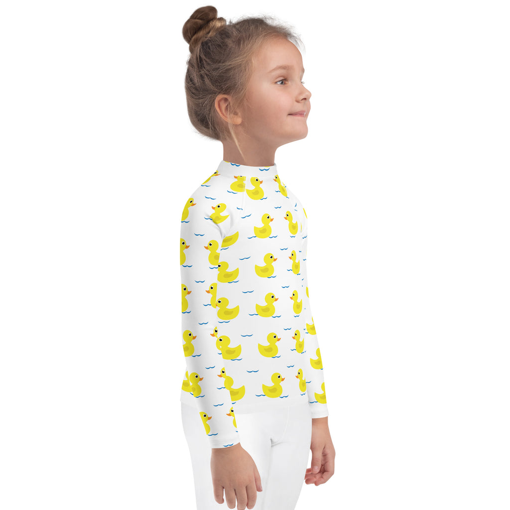 White kids long sleeve rash guard swim shirt with yellow rubber duck pattern and upf 50 plus sun protection