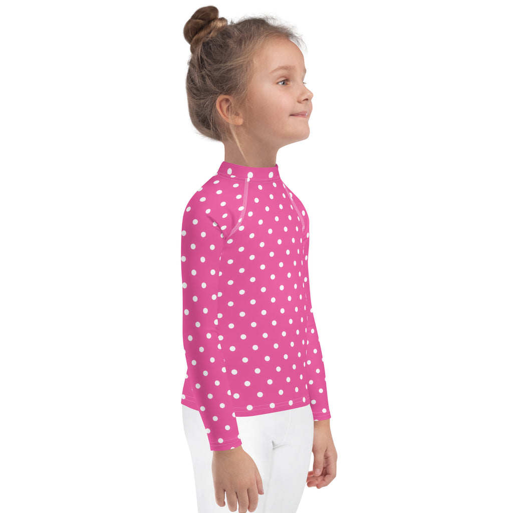 Girls pink long sleeve rash guard swim shirt with white polka dots and upf 50 plus sun protection