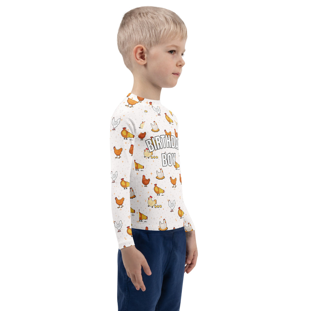 White long sleeve rash guard swim shirt with playful cartoon chicken pattern and birthday boy text with UPF 50+ protection