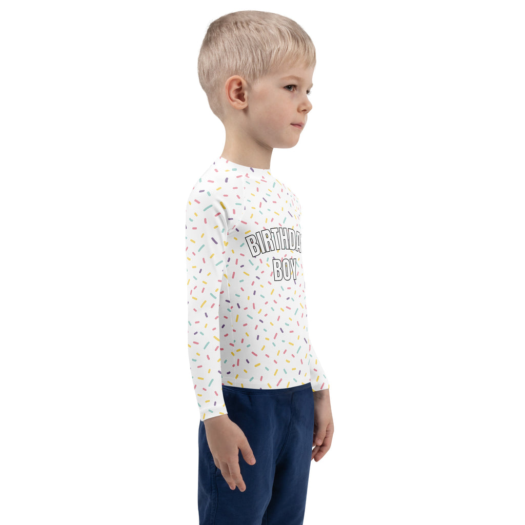 White long-sleeved rash guard swim shirt with colorful sprinkle pattern and birthday boy text with upf 50+ protection