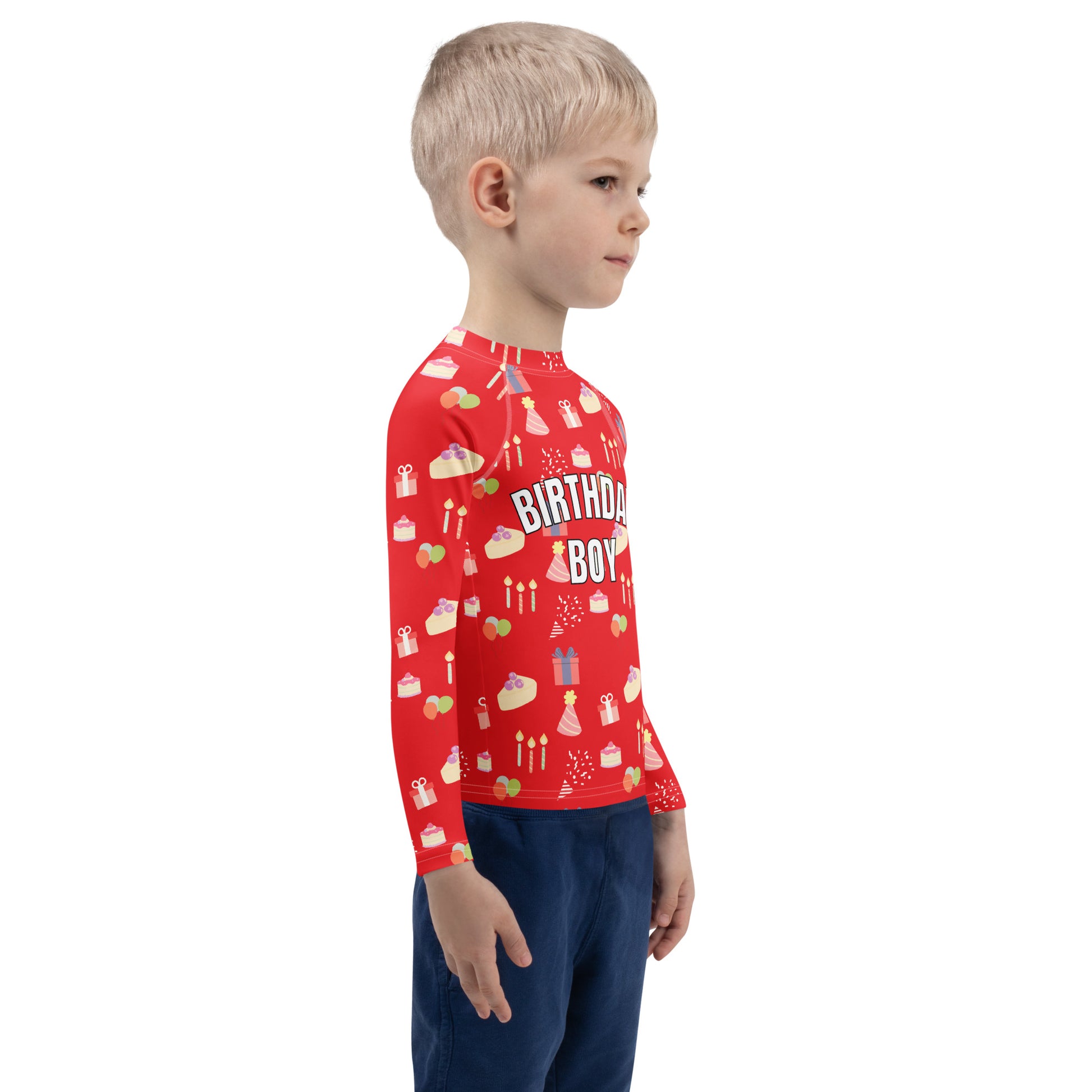 Child wearing a red 'Birthday Boy' shirt with birthday patterns on a white background
