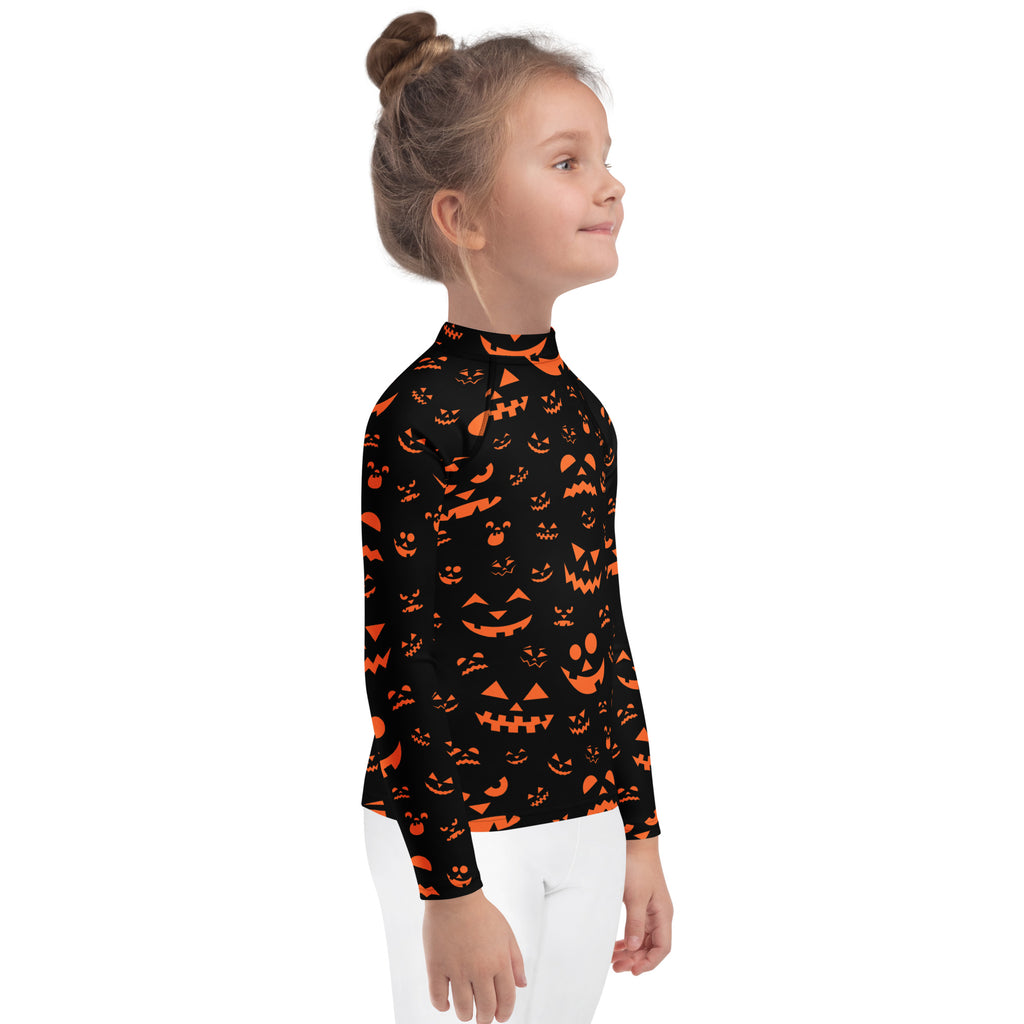 Kids orange jack-o-lantern faces halloween long sleeve rash guard swim shirt with upf 50 plus in black