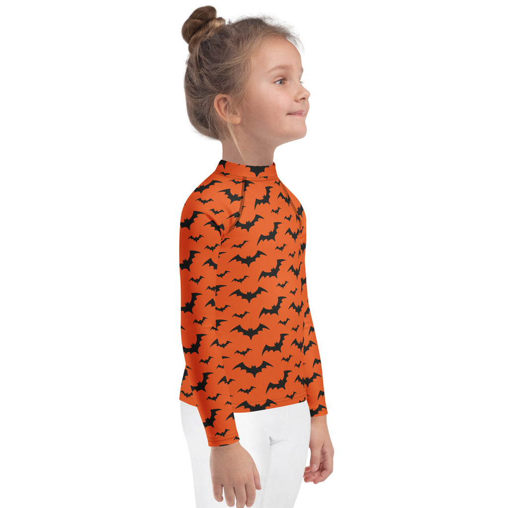 Kids orange long sleeve rash guard swim shirt with black bat pattern and upf 50 plus for halloween protection