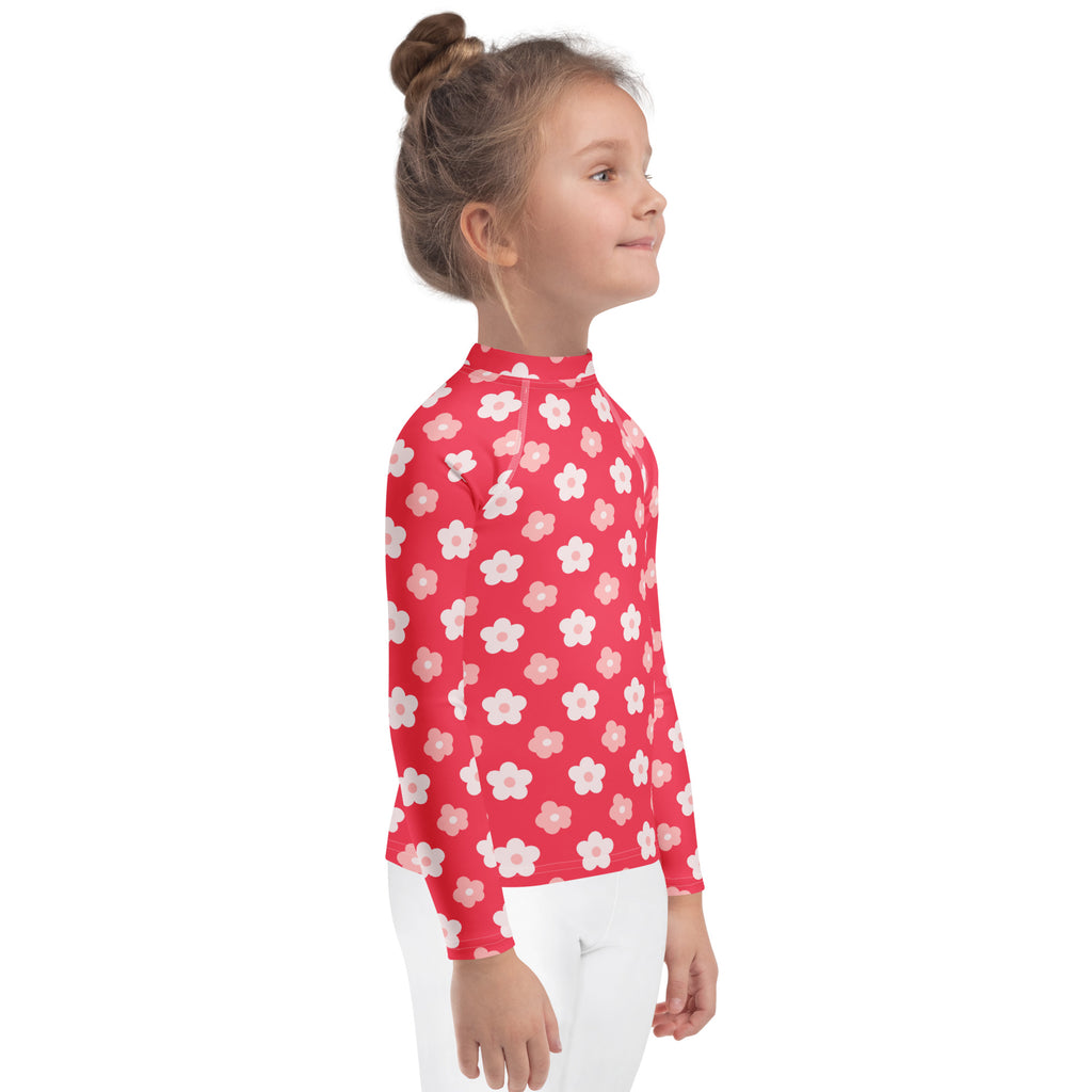 Girls red long sleeve rash guard swim shirt with white and light pink floral pattern and UPF 50 plus sun protection