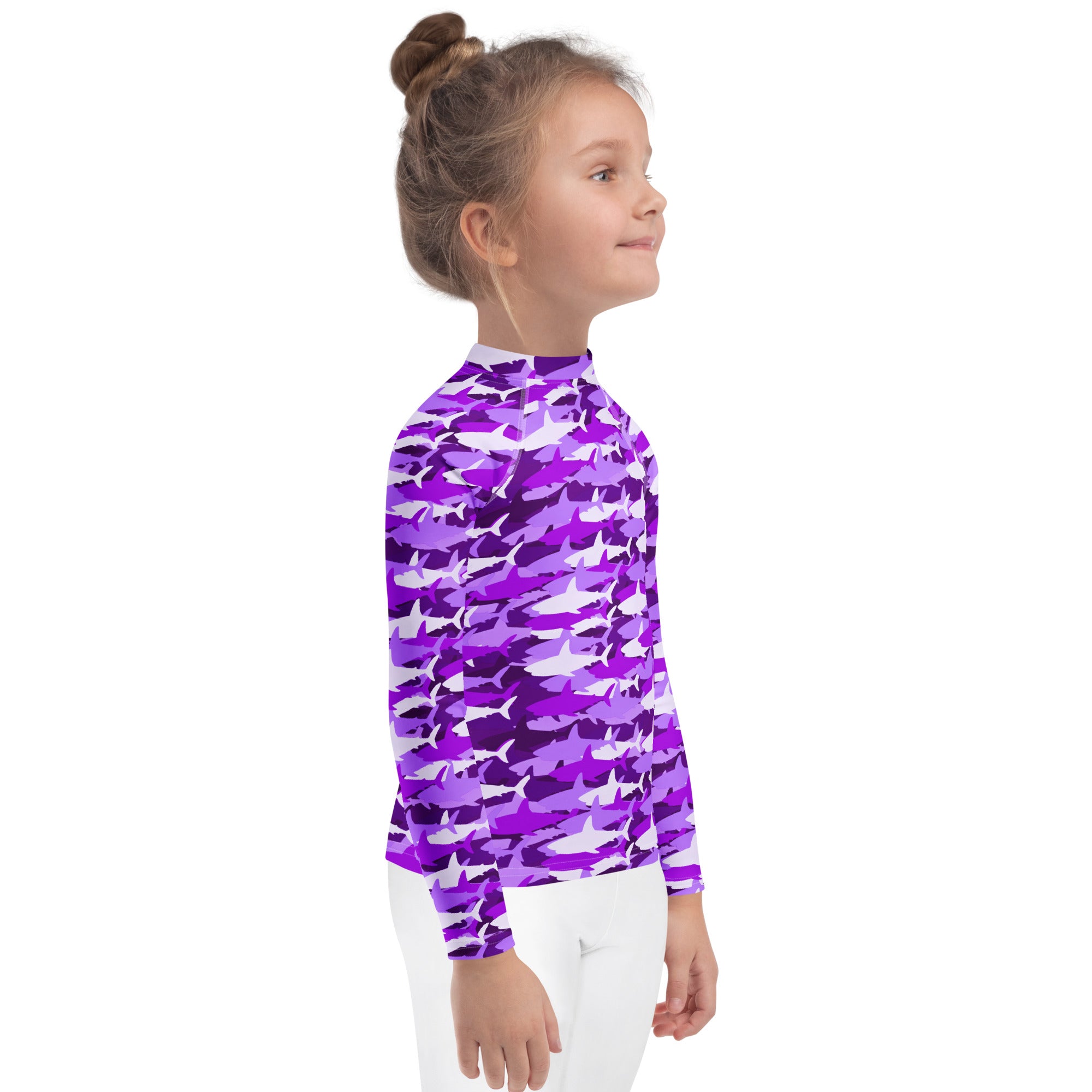 Girls purple and white shark-patterned long sleeve rash guard swim shirt with UPF 50 plus for sun protection