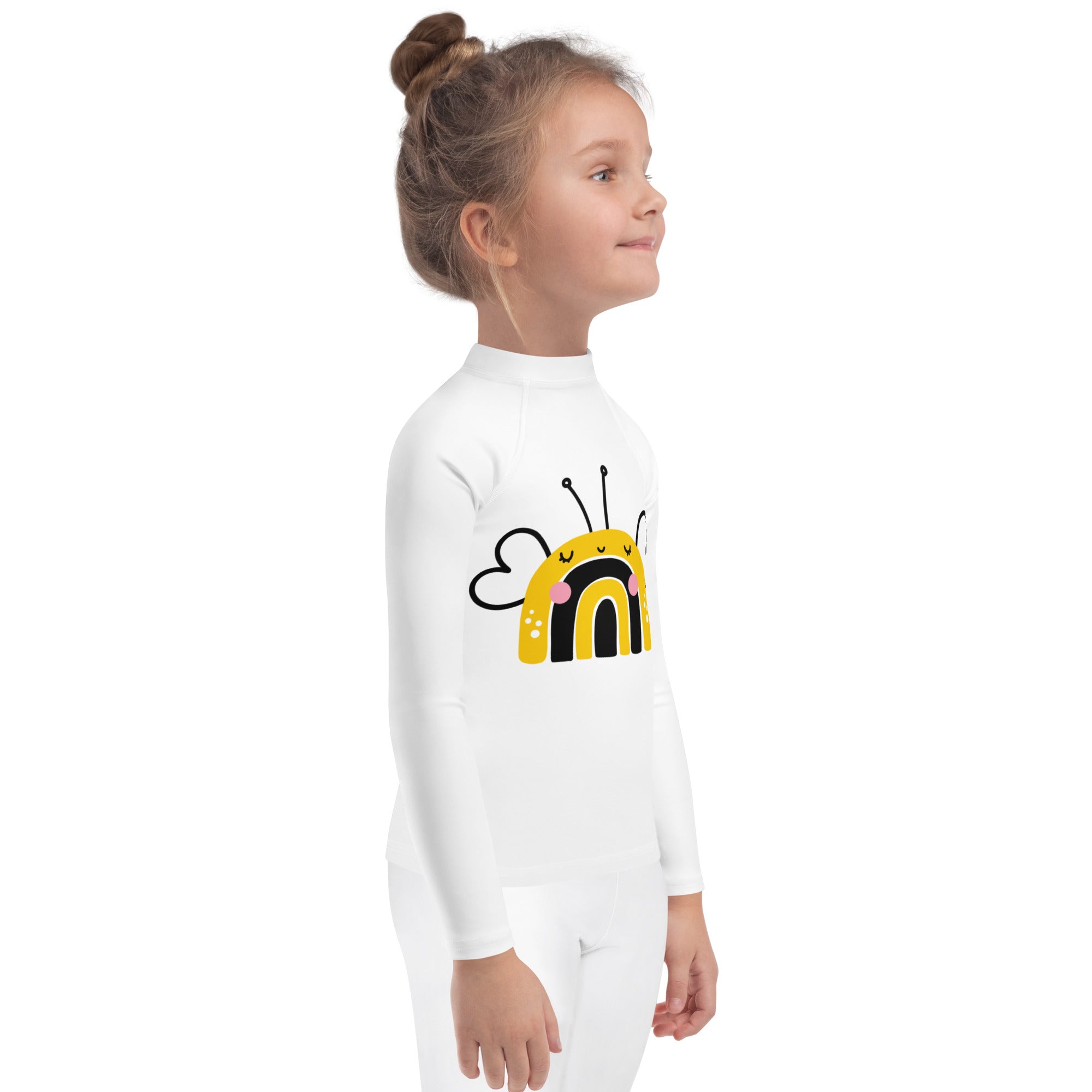 White long sleeve kids rash guard swim shirt with upf 50 plus featuring playful yellow and black bee design and rainbow stripes