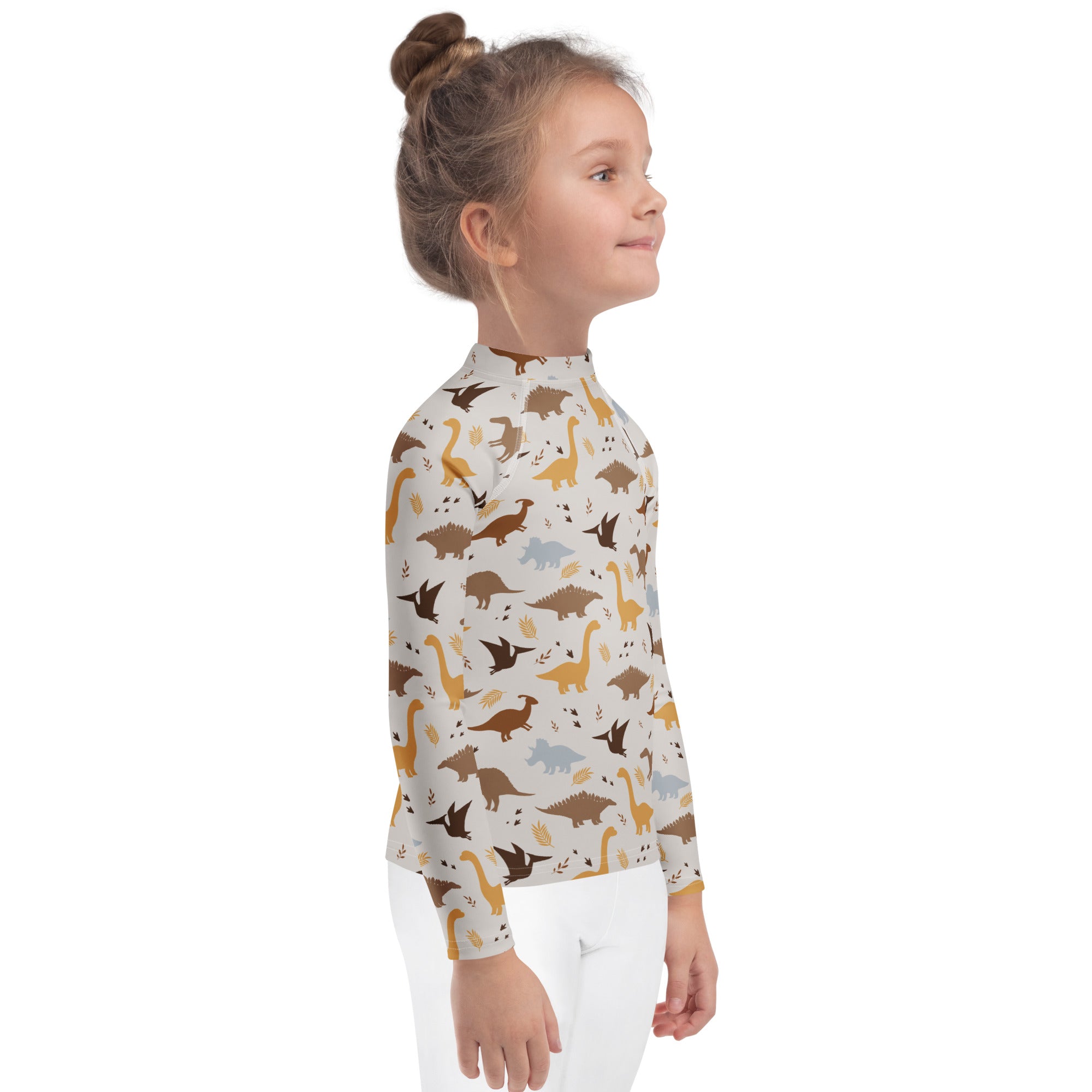 Kids dinosaur long sleeve rash guard swim shirt with upf 50 plus featuring playful brown tan and gray cartoon dinosaurs on off white