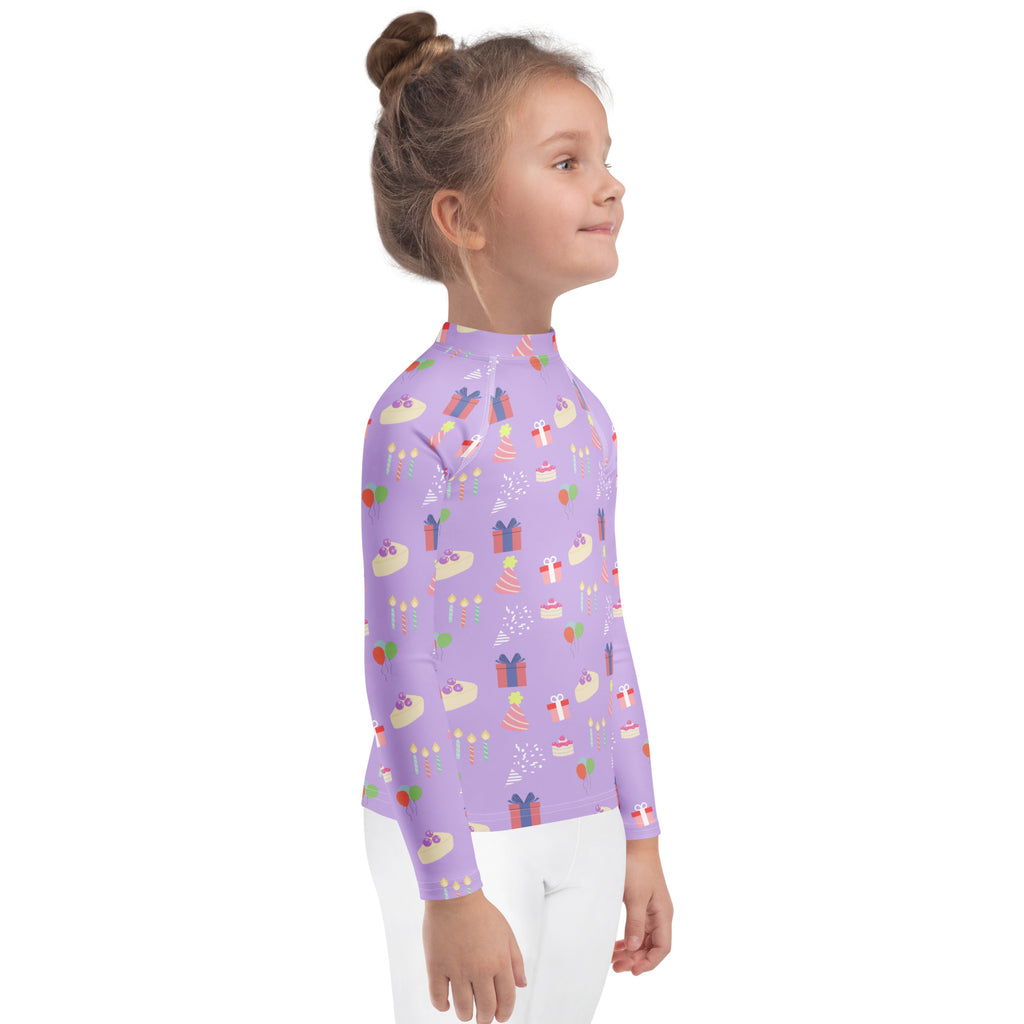 Girls purple long sleeve rash guard swim shirt with cupcakes gift party hat pattern and UPF 50 plus sun protection