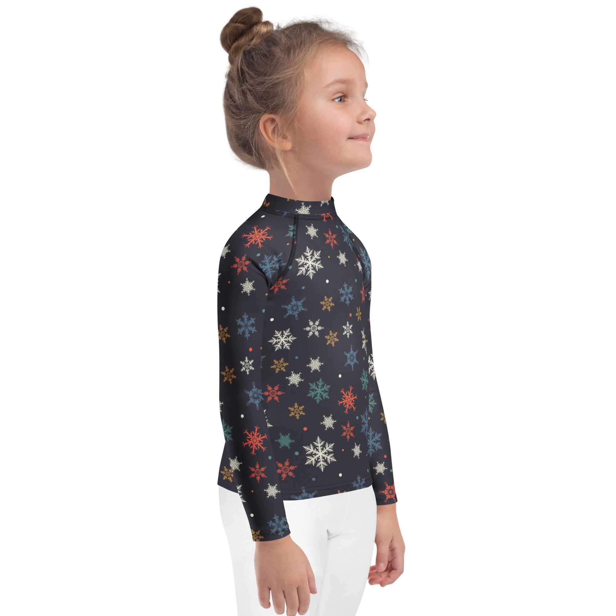 Black long sleeve rash guard for kids with vibrant multicolored snowflakes pattern and UPF 50 plus sun protection