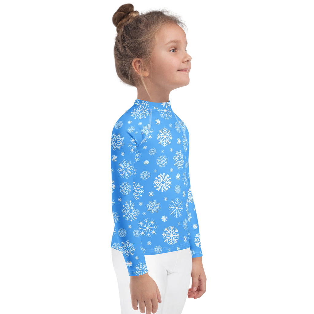 Kids blue long sleeve rash guard swim shirt with white snowflake pattern and upf 50 plus sun protection