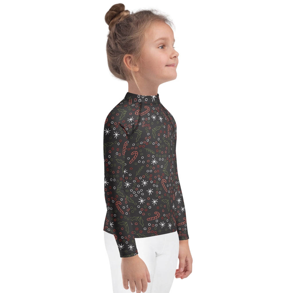 Kids candy cane and holly christmas long sleeve black rash guard swim shirt with festive pattern and upf 50+ protection