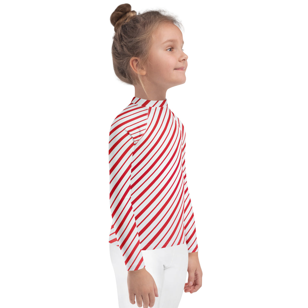 Kids red and white candy cane striped long sleeve rash guard swim shirt with upf 50 plus featuring bold diagonal stripes