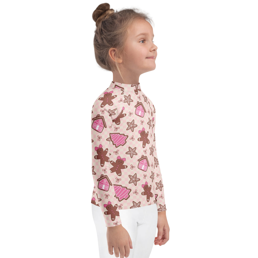 Kids pink long sleeve rash guard swim shirt with playful gingerbread men pattern and upf 50 plus sun protection