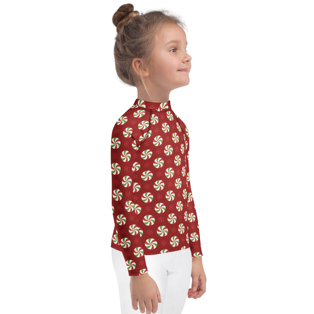 Kids peppermint swirl christmas long sleeve rash guard swim shirt red with green and white peppermint pattern upf 50+