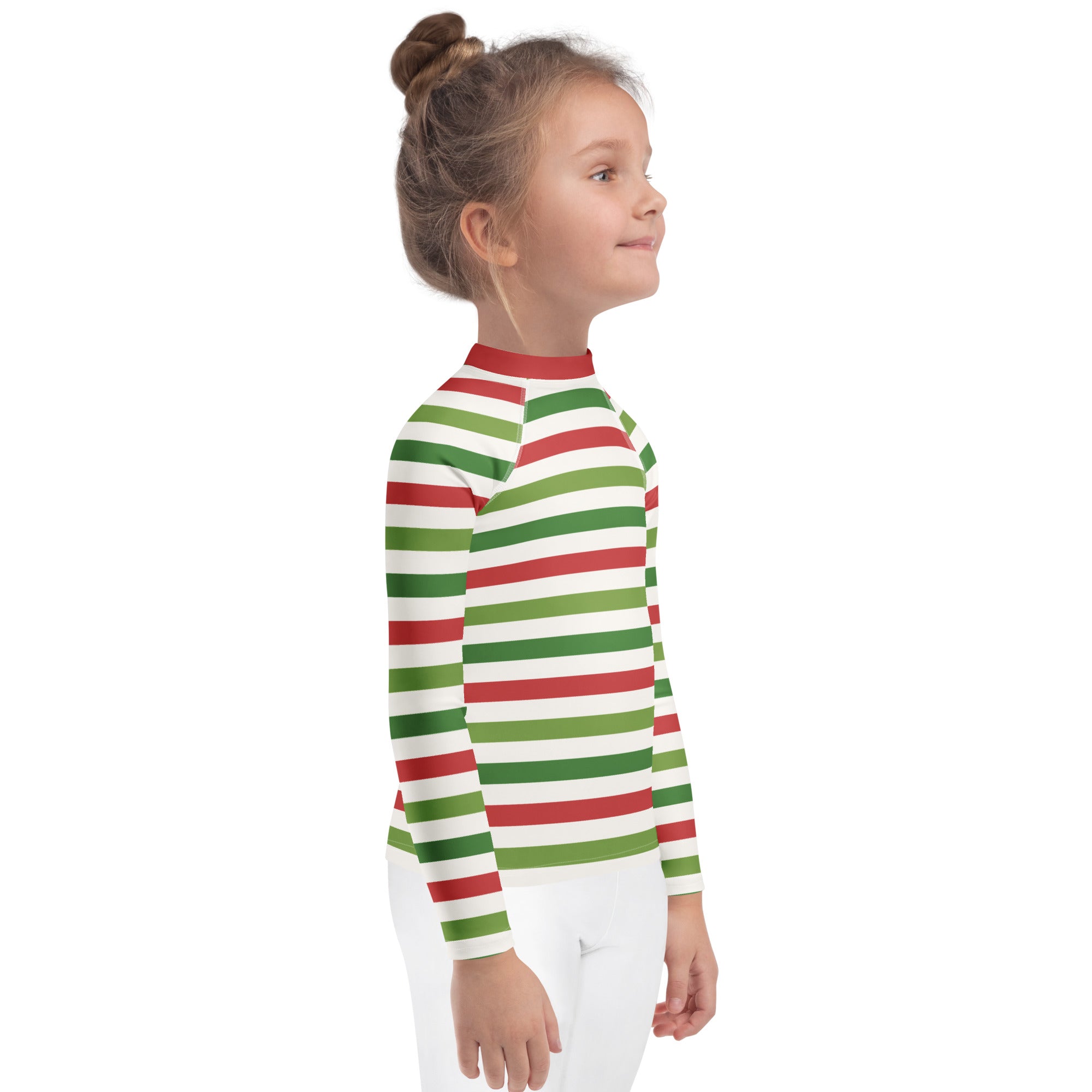 A child wearing a red and green Christmas stripes long sleeve rash guard swim shirt with UPF 50+ protection