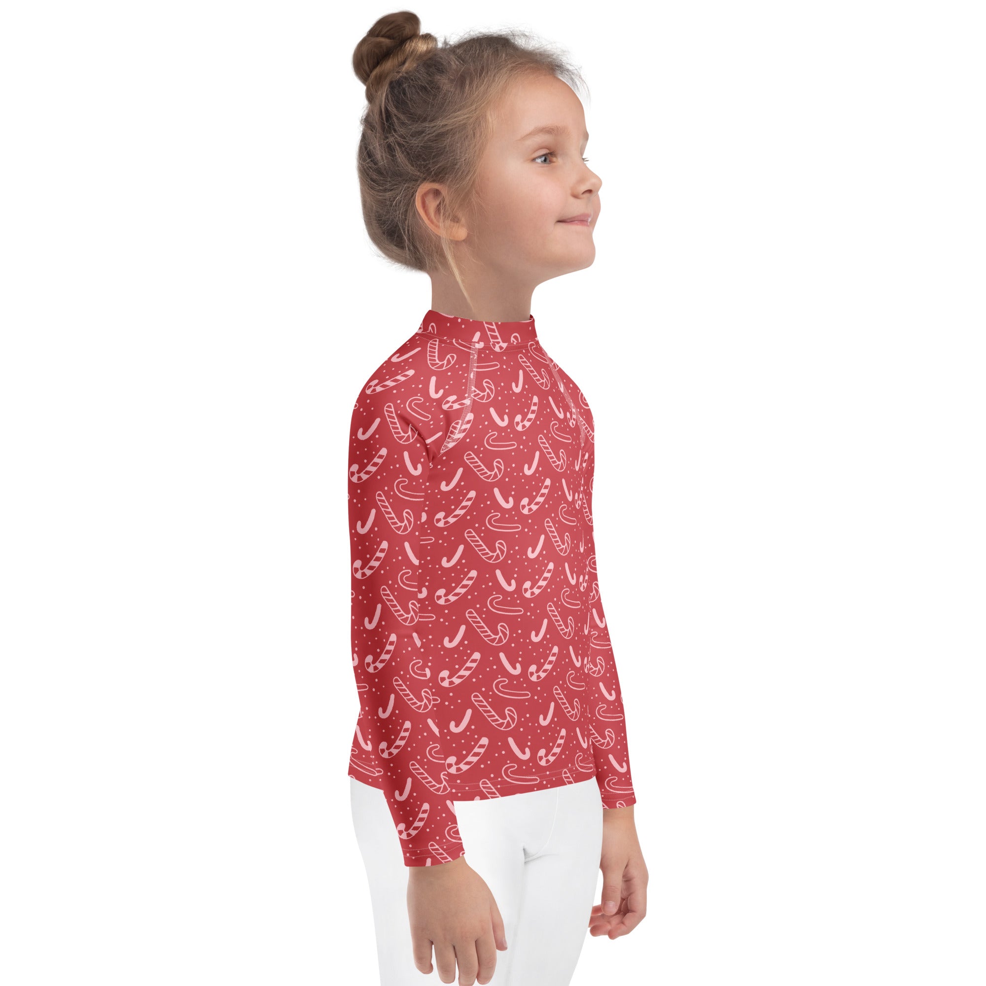 Kids red long sleeve rash guard swim shirt with white candy cane pattern and small dots with UPF 50 plus protection
