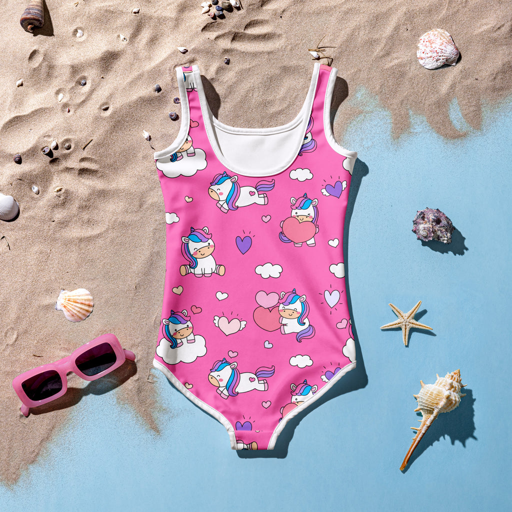 Girls unicorn hearts buttery soft pink one-piece swimsuit with white trim and UPF 50+ featuring cartoon unicorns and clouds