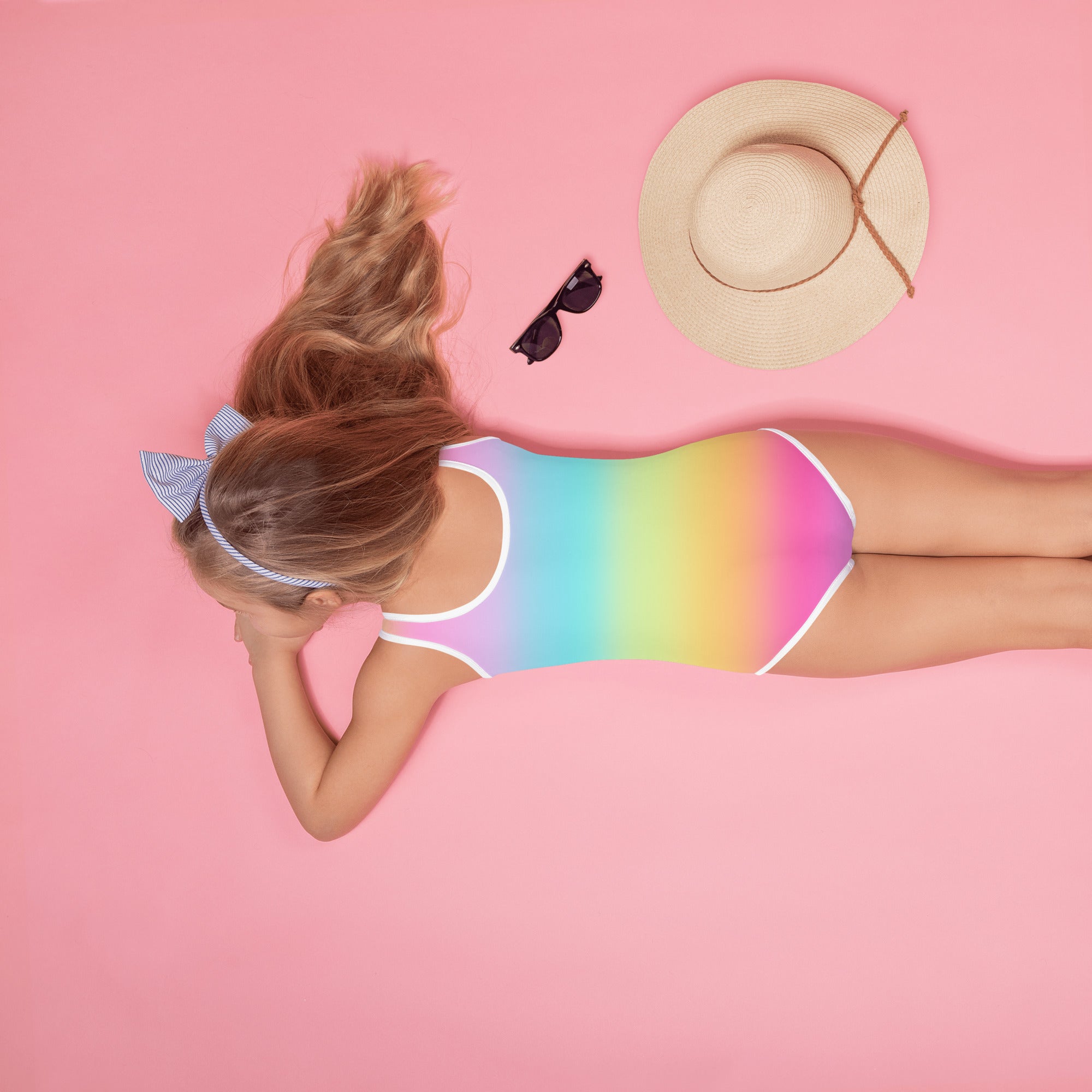 Girls bright rainbow one-piece swimsuit with white trim buttery soft fabric and upf 50 plus sun protection