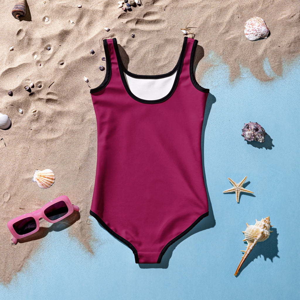 A vibrant magenta girls buttery soft one-piece swimsuit with black trim white lining and UPF 50 plus protection