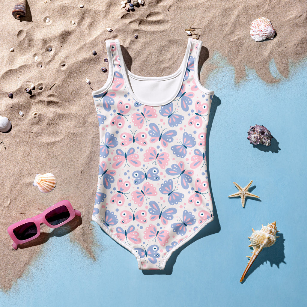 Girls pink and lavender butterfly pattern one-piece swimsuit with white trim buttery soft fabric and UPF 50+ protection