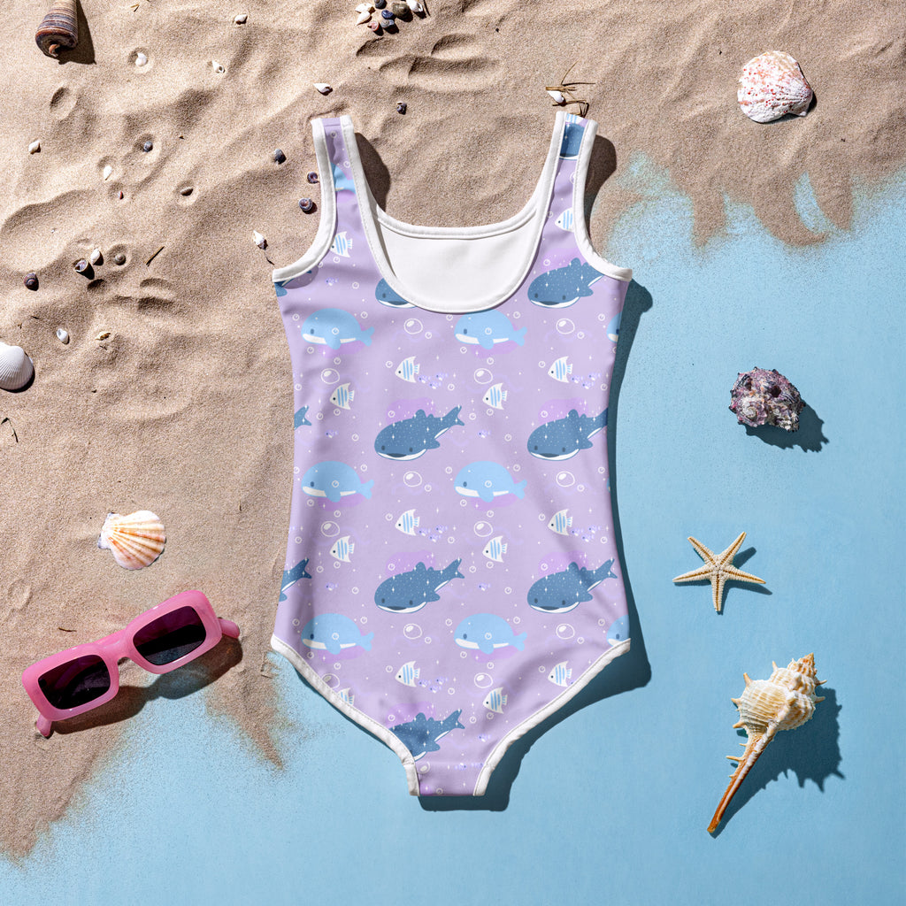 Girls purple whale shark buttery soft one-piece swimsuit with upf 50 plus lavender fabric and blue shark pattern