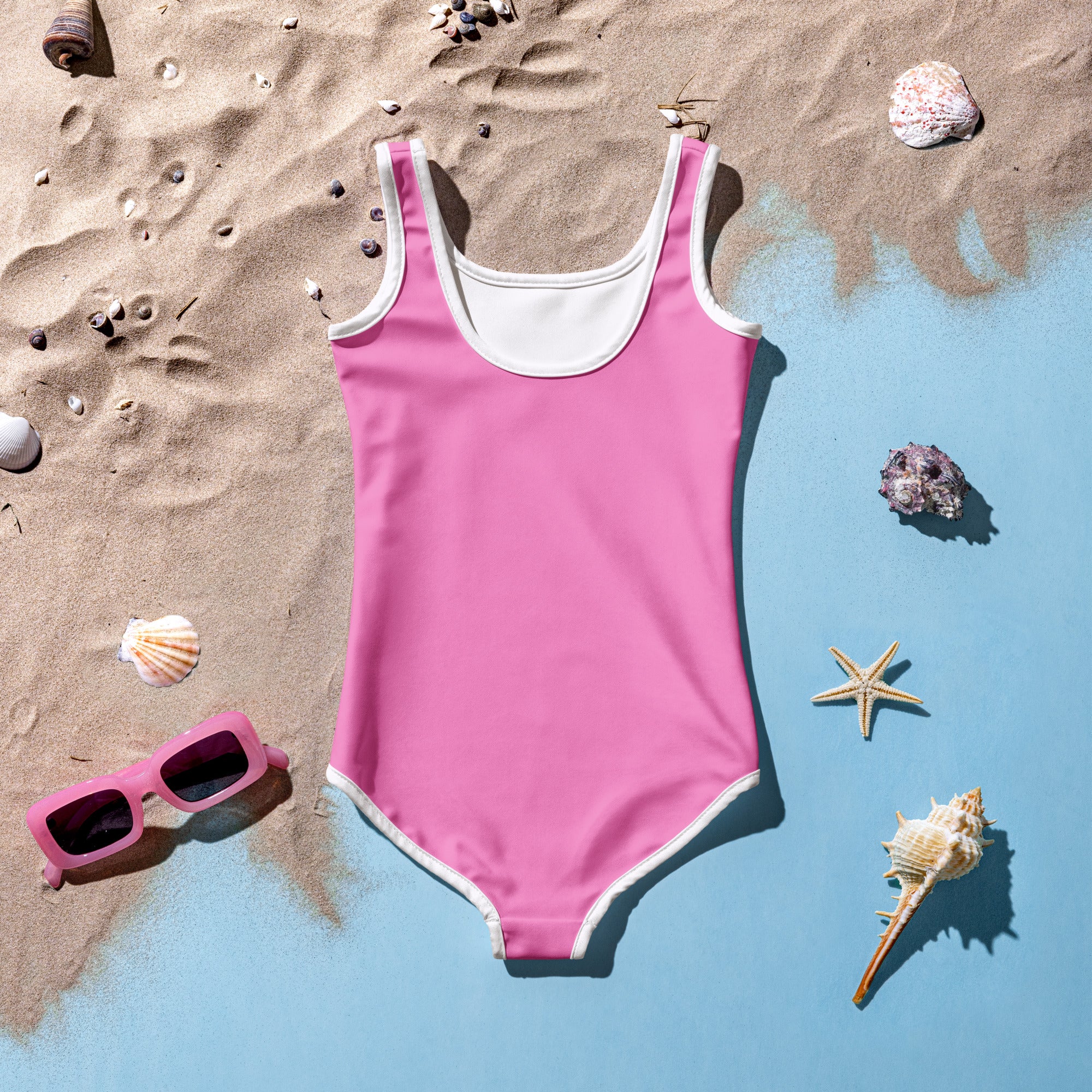Girls buttery soft pink one-piece swimsuit with white trim and UPF 50 plus sun protection for outdoor swimwear