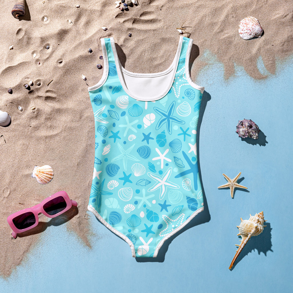Girls starfish and seashell buttery soft turquoise one-piece swimsuit with white trim and UPF 50 plus protection