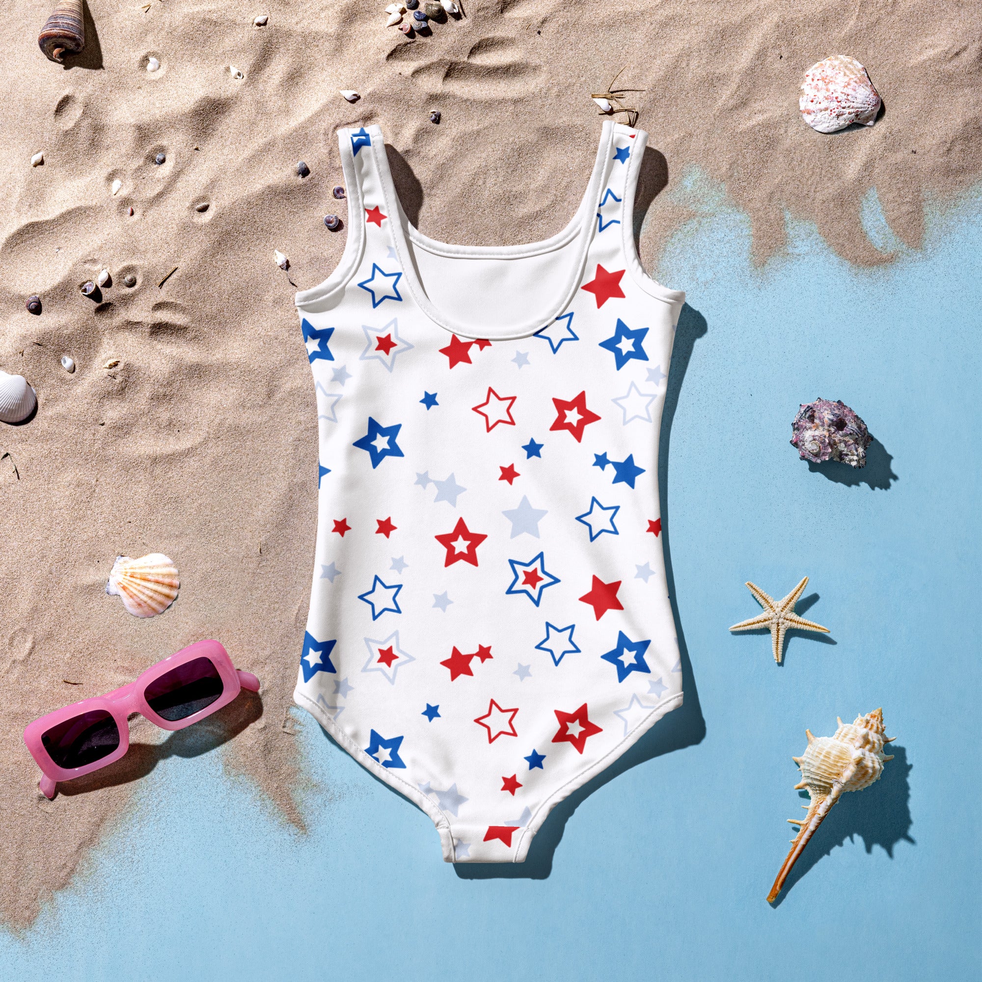 White one-piece swimsuit for girls with red blue and silver stars perfect for 4th of july celebrations