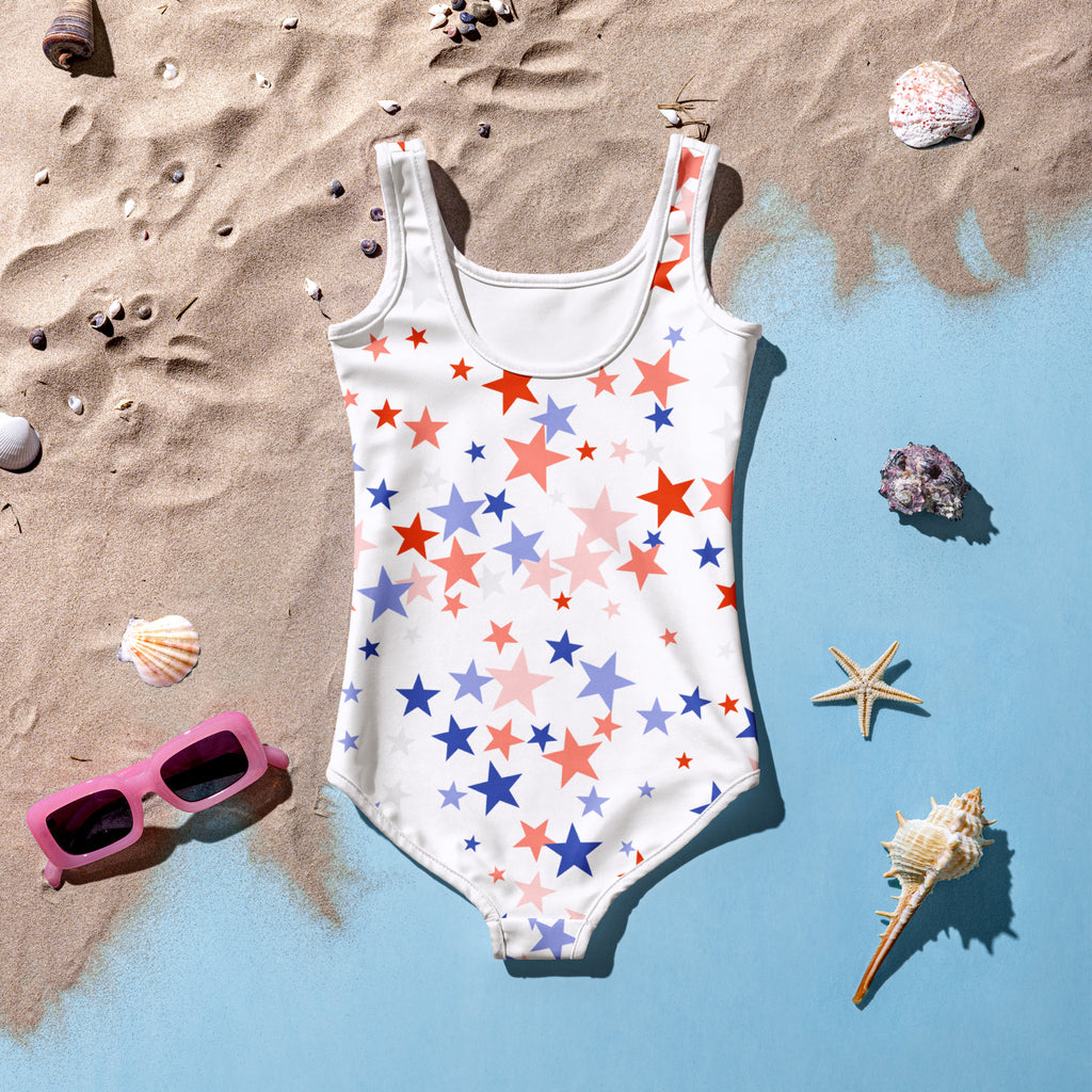 White girls one-piece swimsuit with red blue and pink star pattern for 4th of july celebration