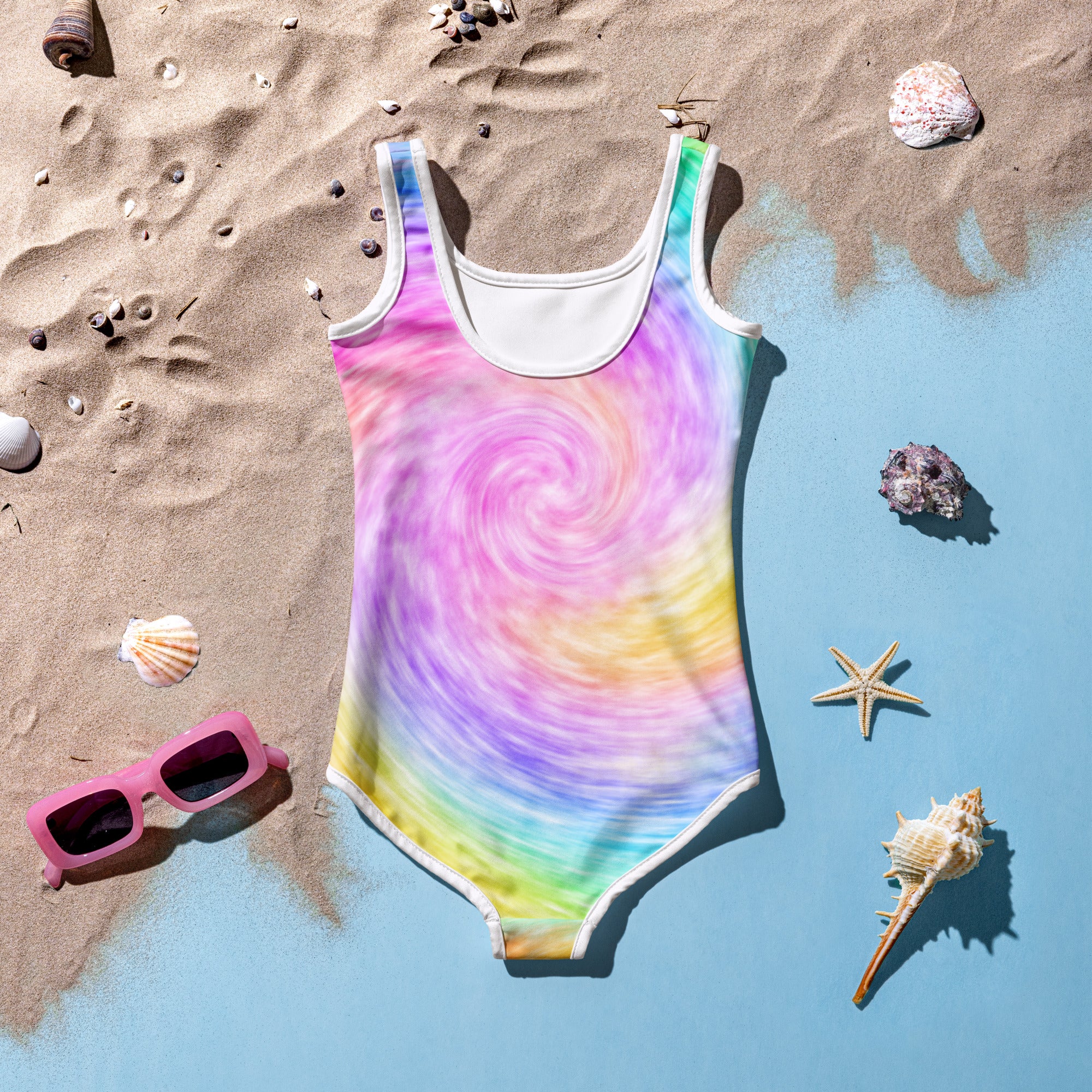 A girls vibrant rainbow swirl one-piece swimsuit with white trim buttery soft fabric and UPF 50 plus protection