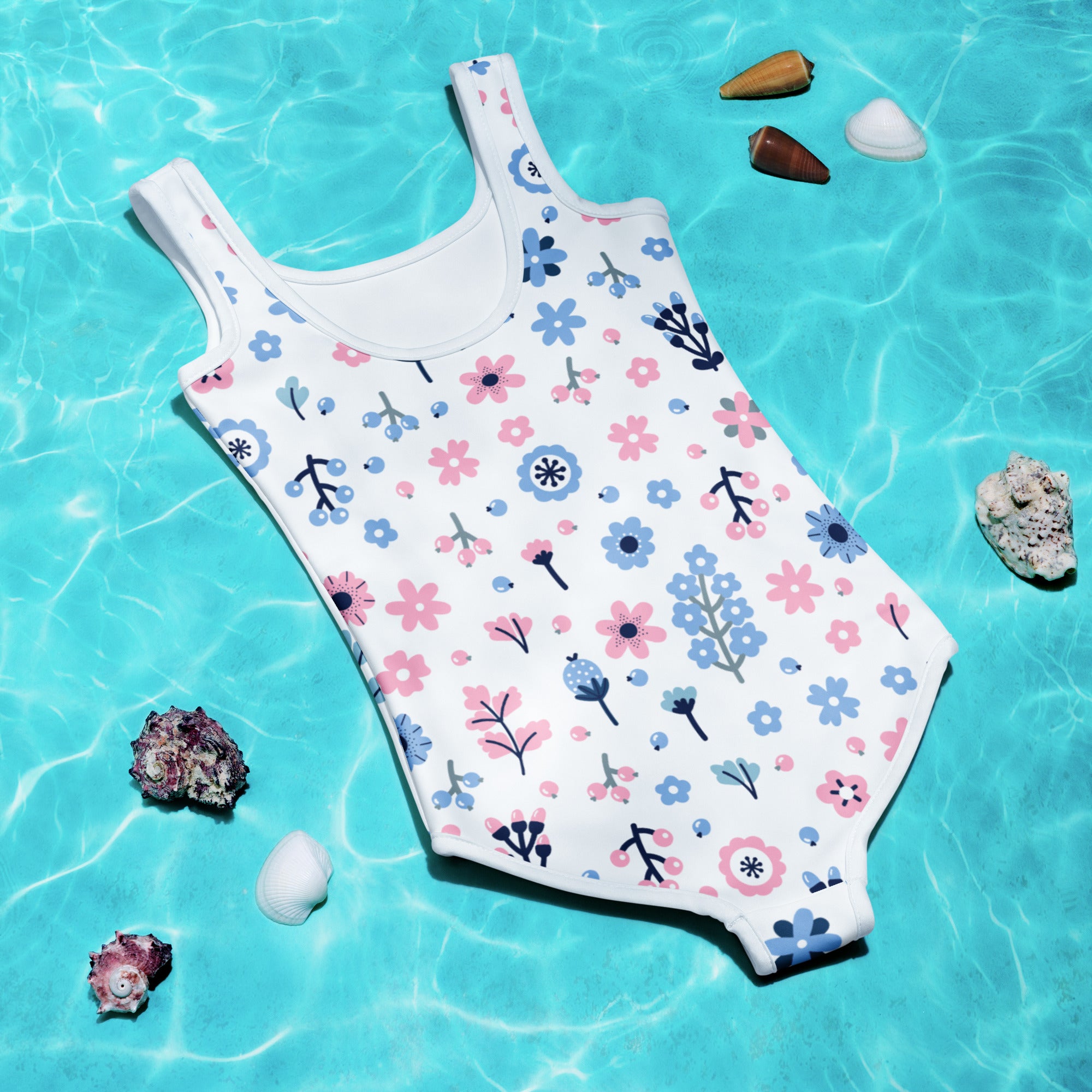 A girls white one-piece swimsuit with purple and blue floral pattern green stems buttery soft fabric and upf 50+ protection