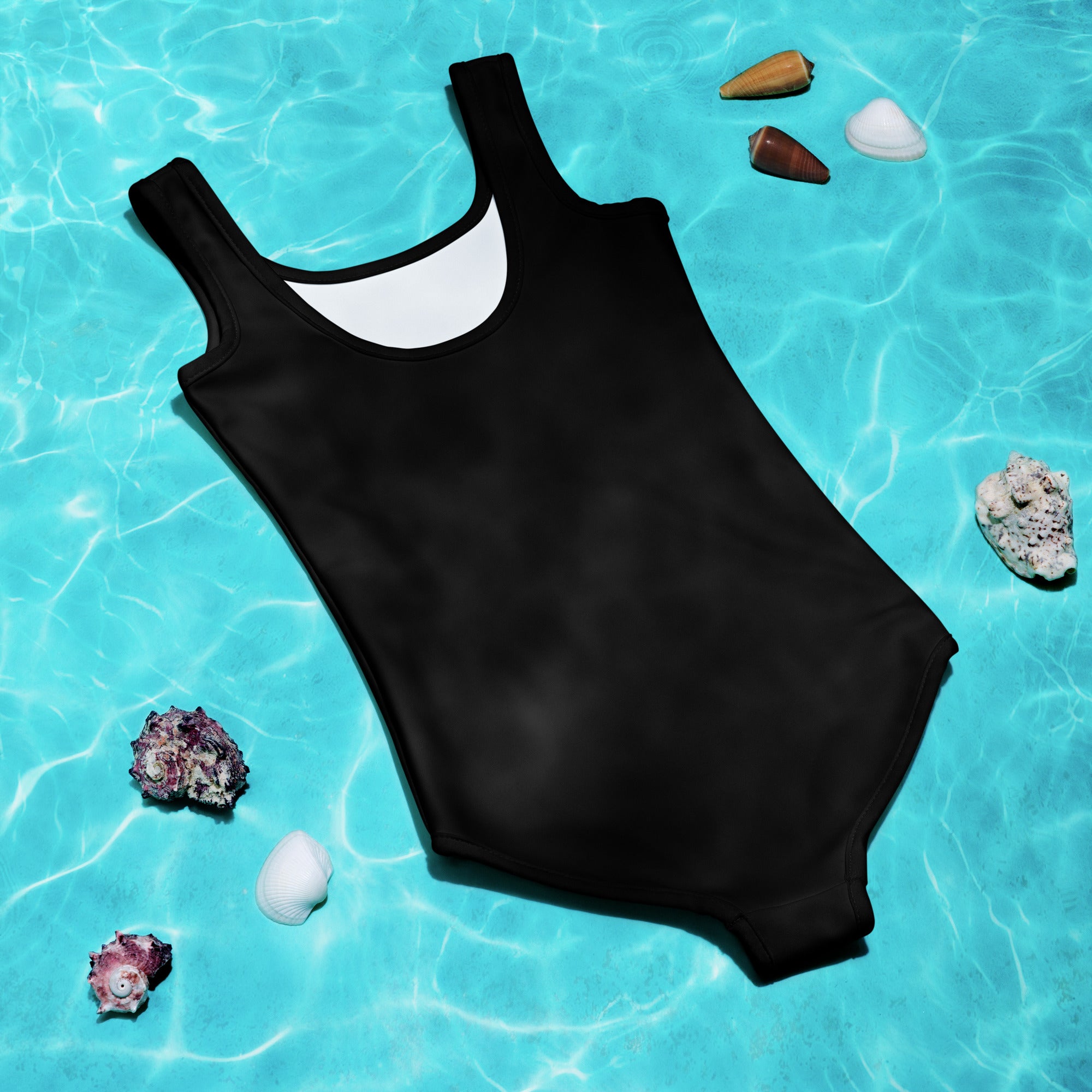 Black one-piece girls swimsuit with white lining scoop neckline buttery soft fabric and upf 50 plus protection laid flat
