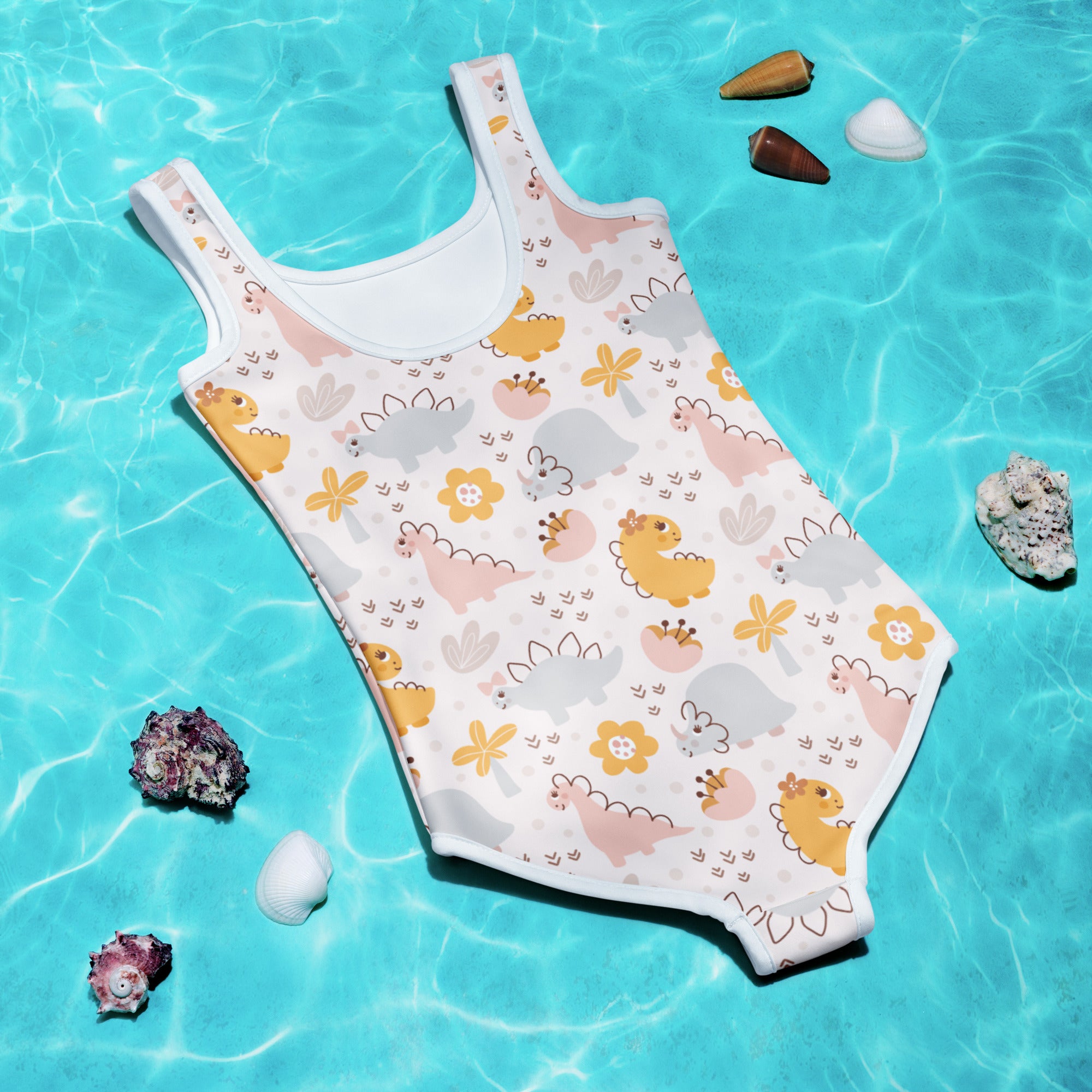 White one-piece girls swimsuit with yellow pink gray cartoon dinosaurs floral pattern buttery soft with UPF 50+ protection