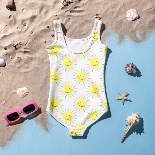 White one-piece girls swimsuit with colorful smiling sun pattern buttery soft fabric and upf 50 plus protection