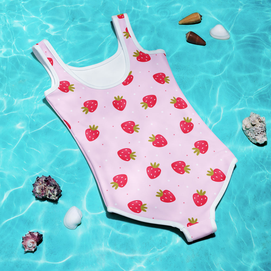 Girls strawberry buttery soft pink one-piece swimsuit with white trim and upf 50 plus sun protection