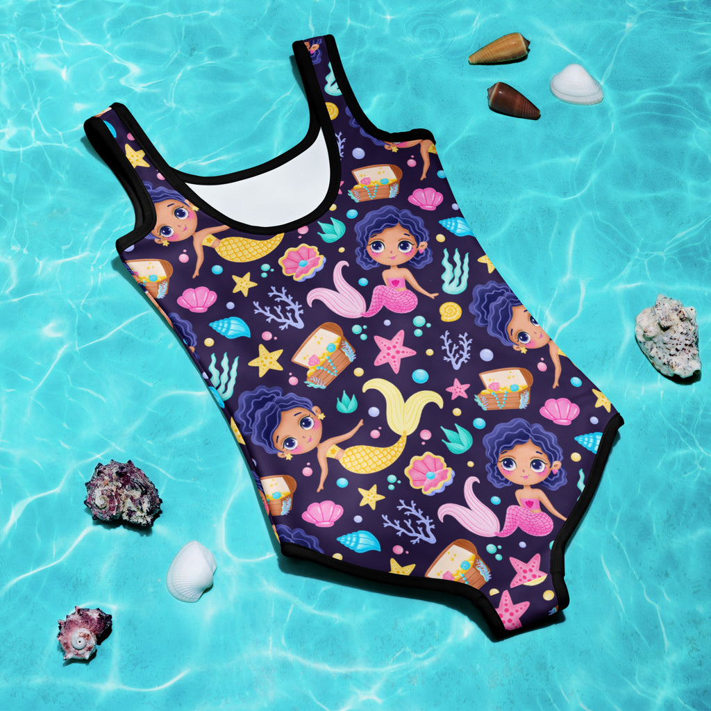 Navy blue girls one-piece swimsuit with playful cartoon mermaid pattern pink yellow accents black trim buttery soft fabric upf 50+