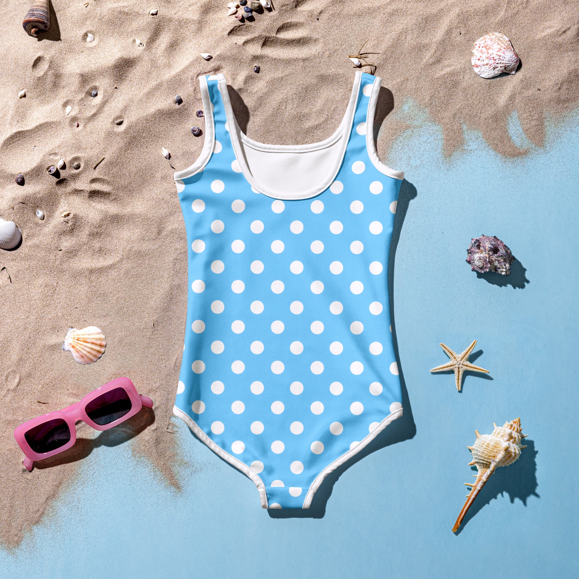 Girls blue polka dots buttery soft one-piece swimsuit with white trim and UPF 50 plus sun protection