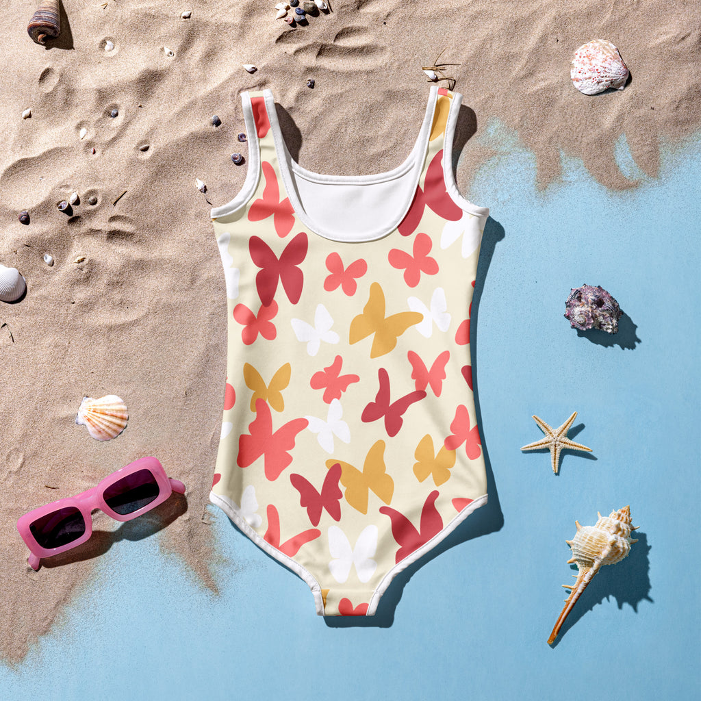 Girls butterfly buttery soft swimsuit with upf 50 plus featuring a pale yellow base and red orange white butterfly pattern