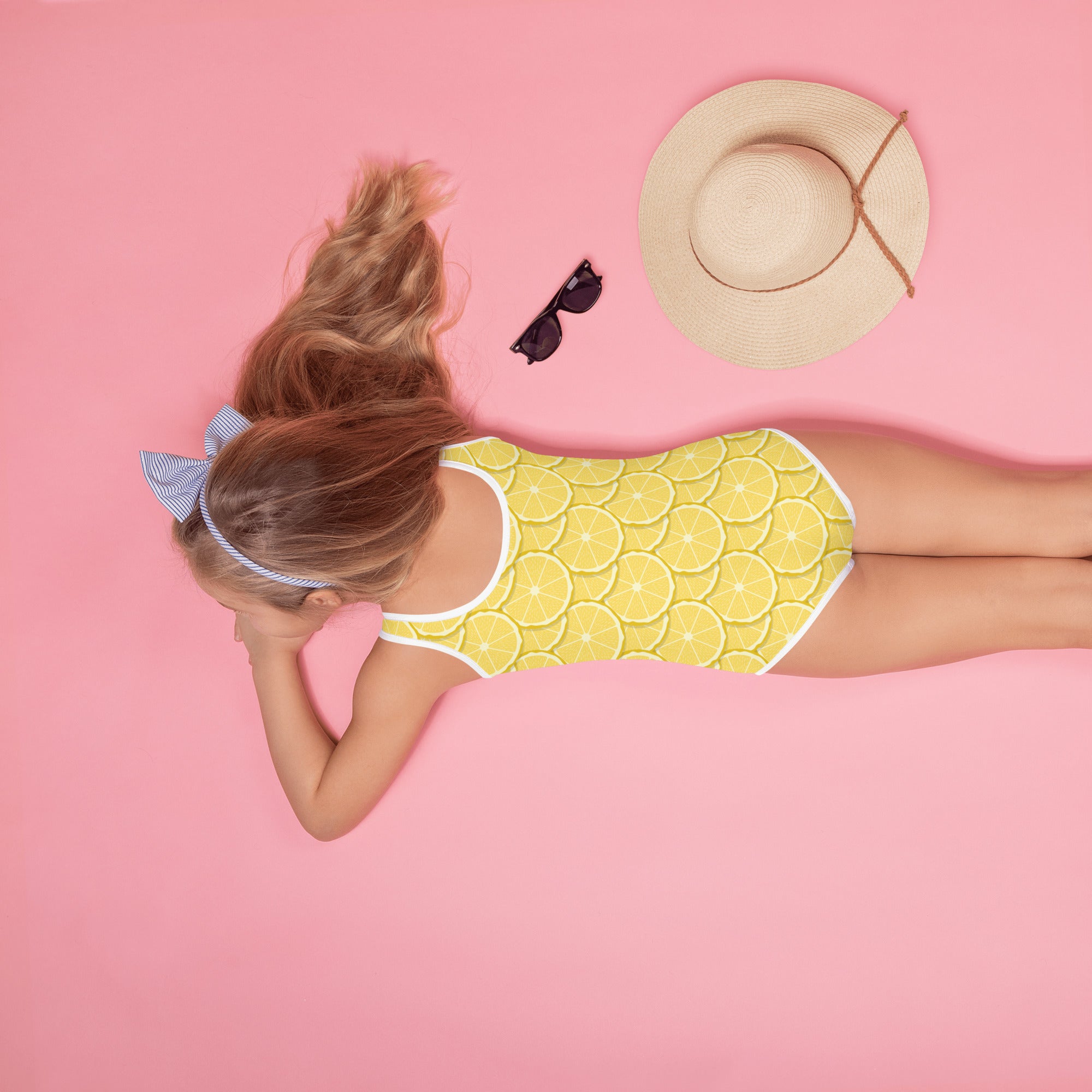 Girls tropical lemons buttery soft yellow one-piece swimsuit with sliced lemon pattern and white trim upf 50+