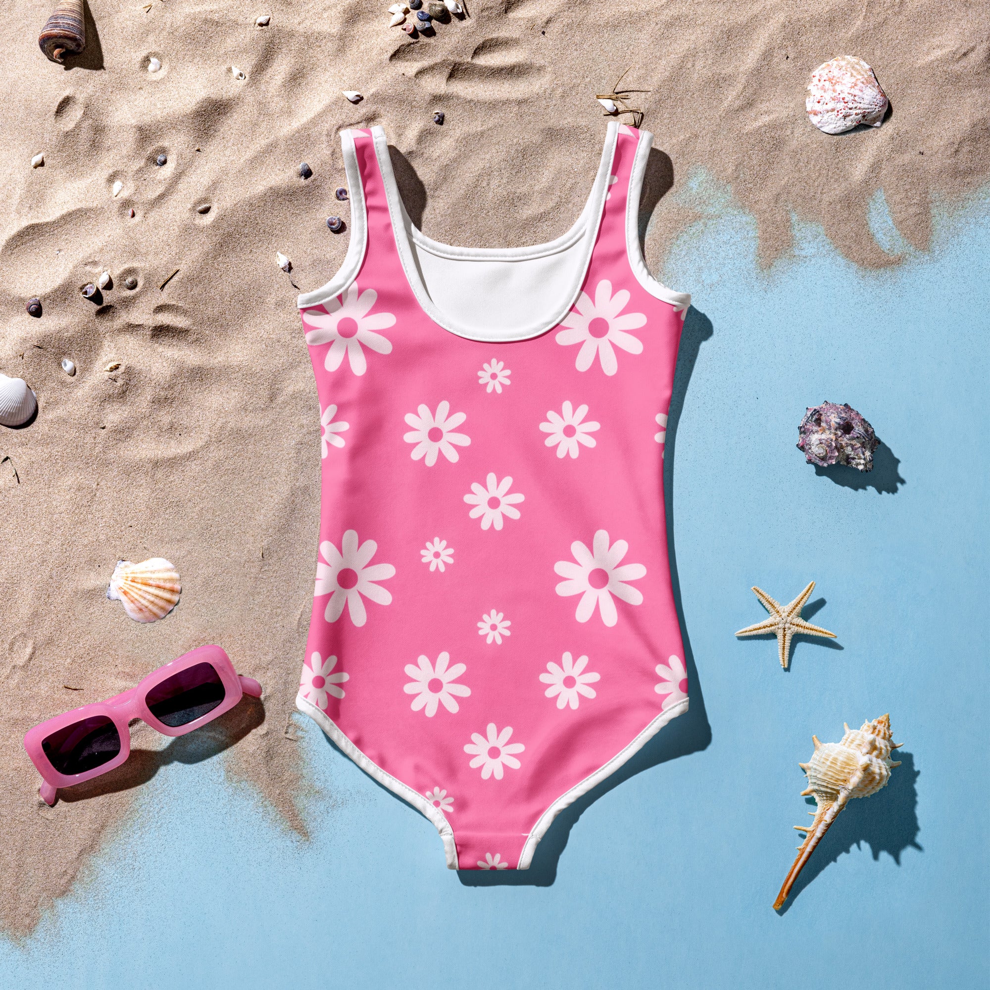 Girls pink one-piece swimsuit with white daisy pattern white trim buttery soft fabric and upf 50 plus protection