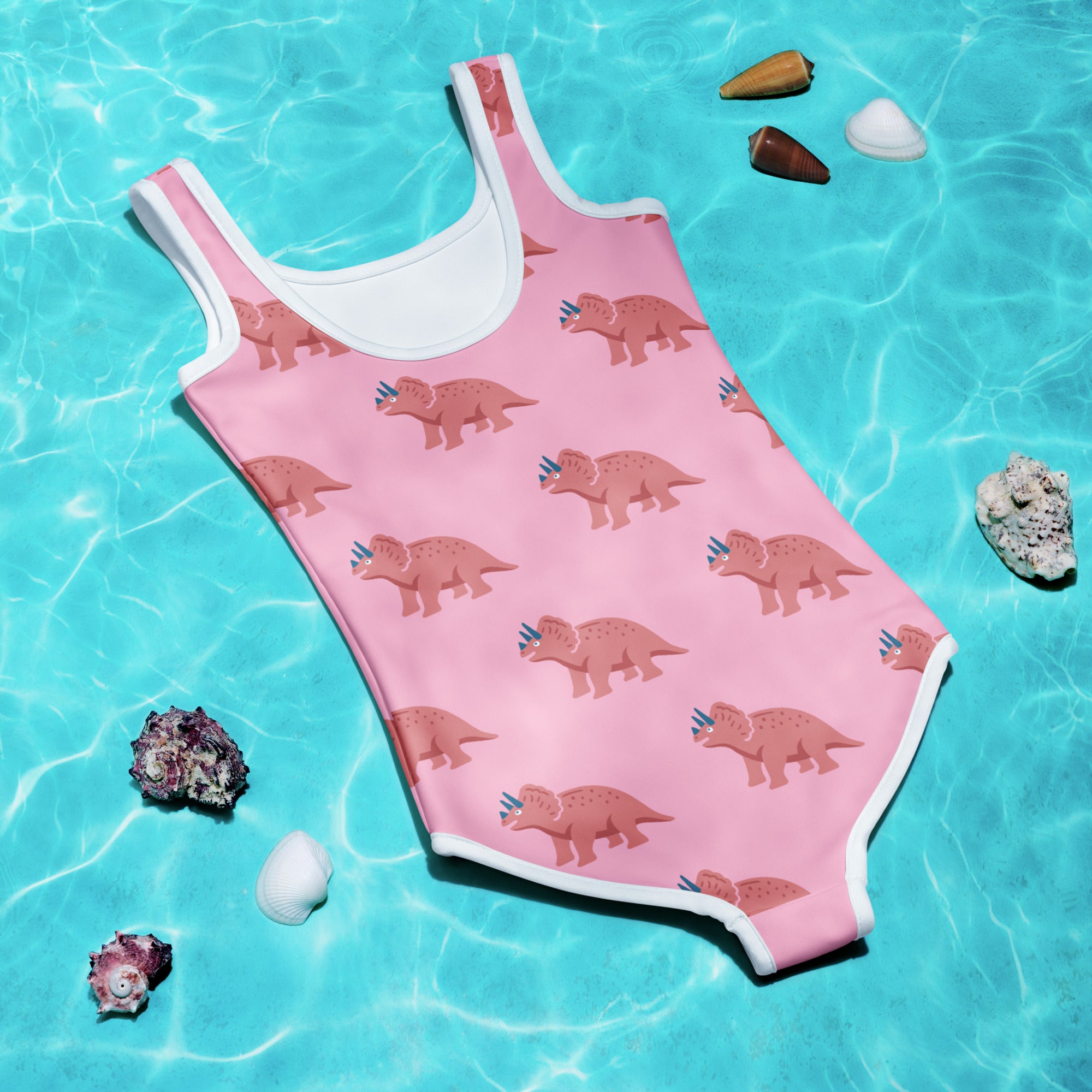 Girls pink triceratops buttery soft one-piece swimsuit with white trim and UPF 50 plus sun protection