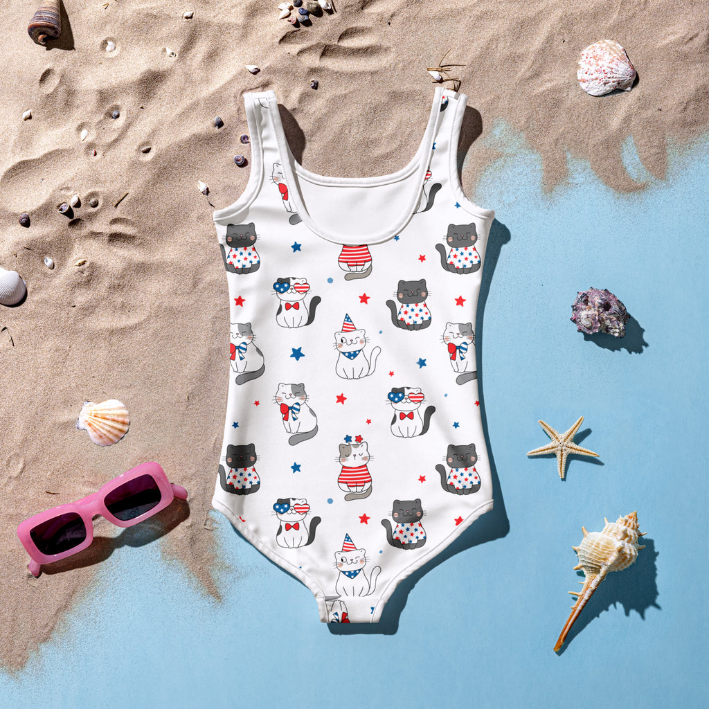 White girls one-piece swimsuit with patriotic red white and blue cartoon cats stars and polka dots buttery soft fabric upf 50+