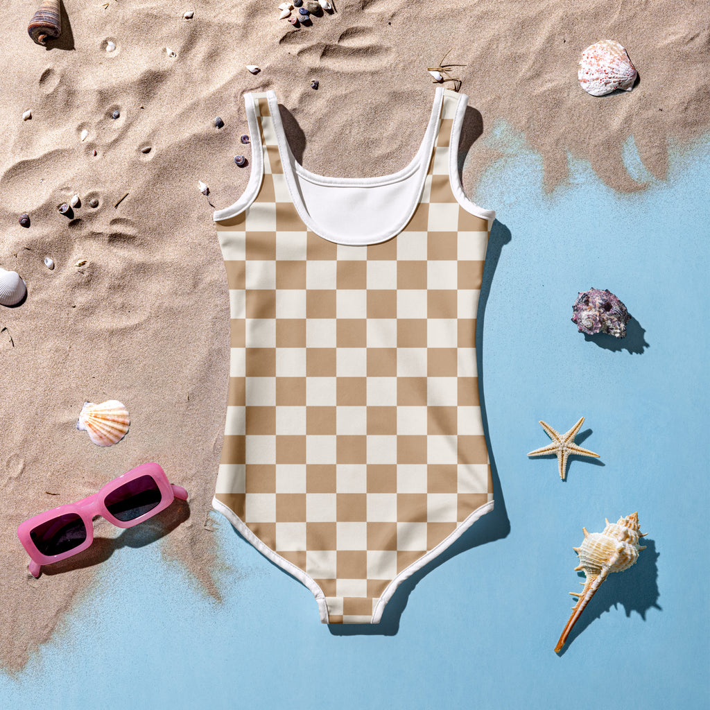 Girls sand checkerboard buttery soft beige and cream checkered one-piece swimsuit with white trim and upf 50 plus protection