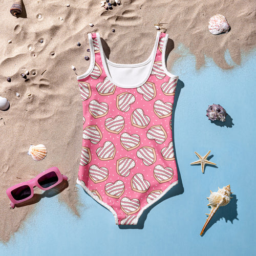 Pink girls one-piece swimsuit with white trim and heart cookie pattern buttery soft with upf 50 plus protection