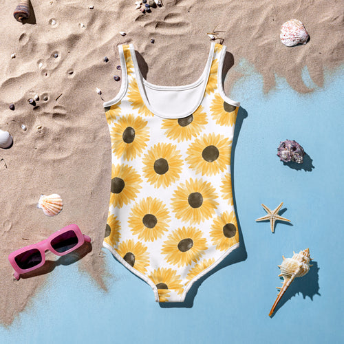 Girls doodle sunflower buttery soft white one-piece swimsuit with vibrant yellow pattern and dark brown centers with UPF 50+
