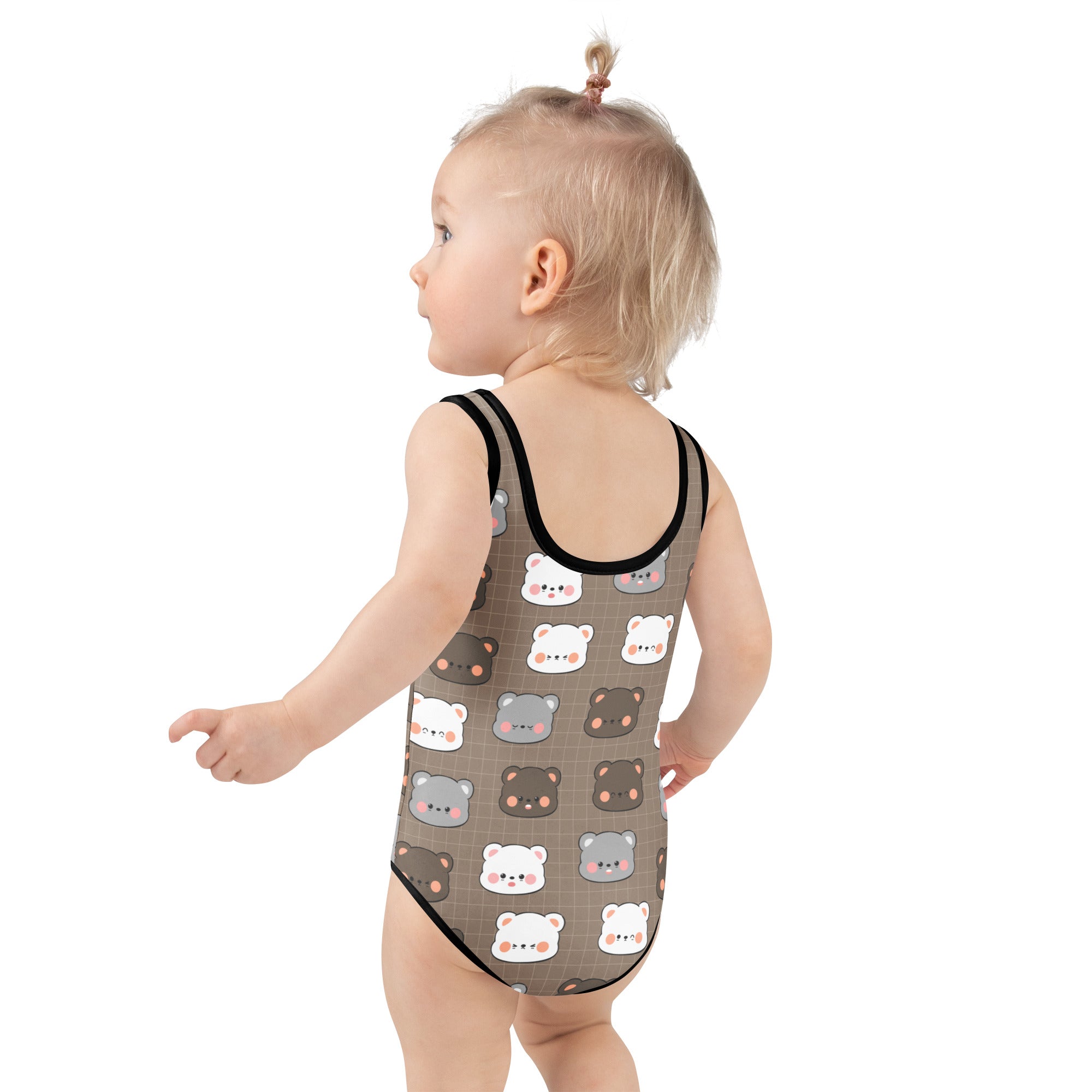 A toddler wearing a girls bear themed buttery soft brown swimsuit with black trim and UPF 50+ sun protection