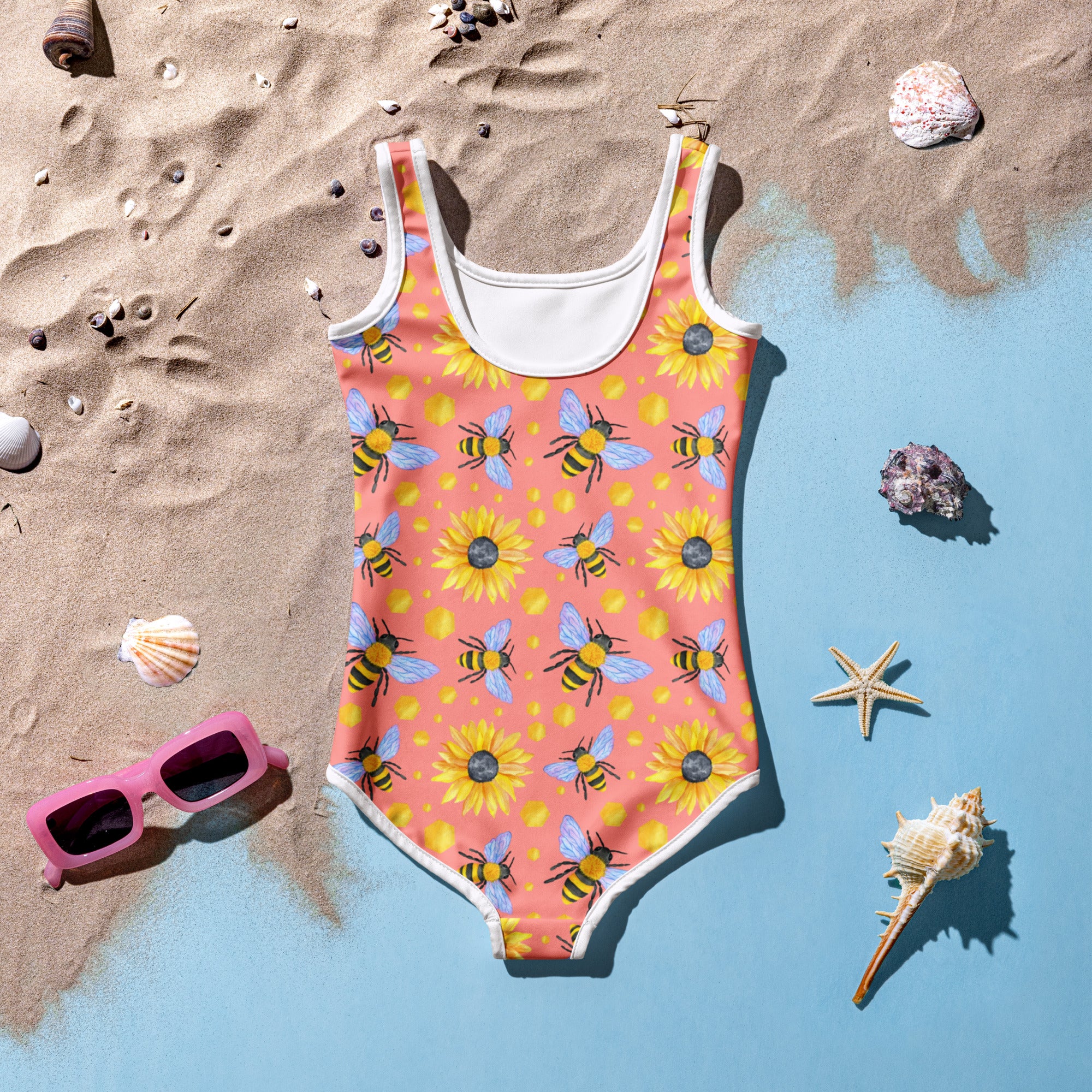 Girls bee and sunflower buttery soft coral swimsuit with white trim yellow sunflowers black and yellow bees and UPF 50+