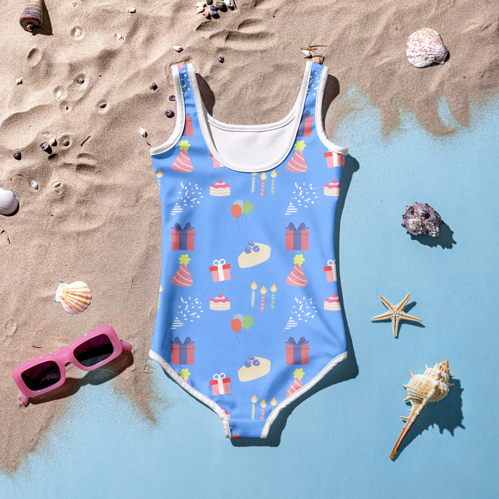 Girls blue birthday party buttery soft swimsuit with UPF 50+ featuring colorful hats cakes gifts and candles print