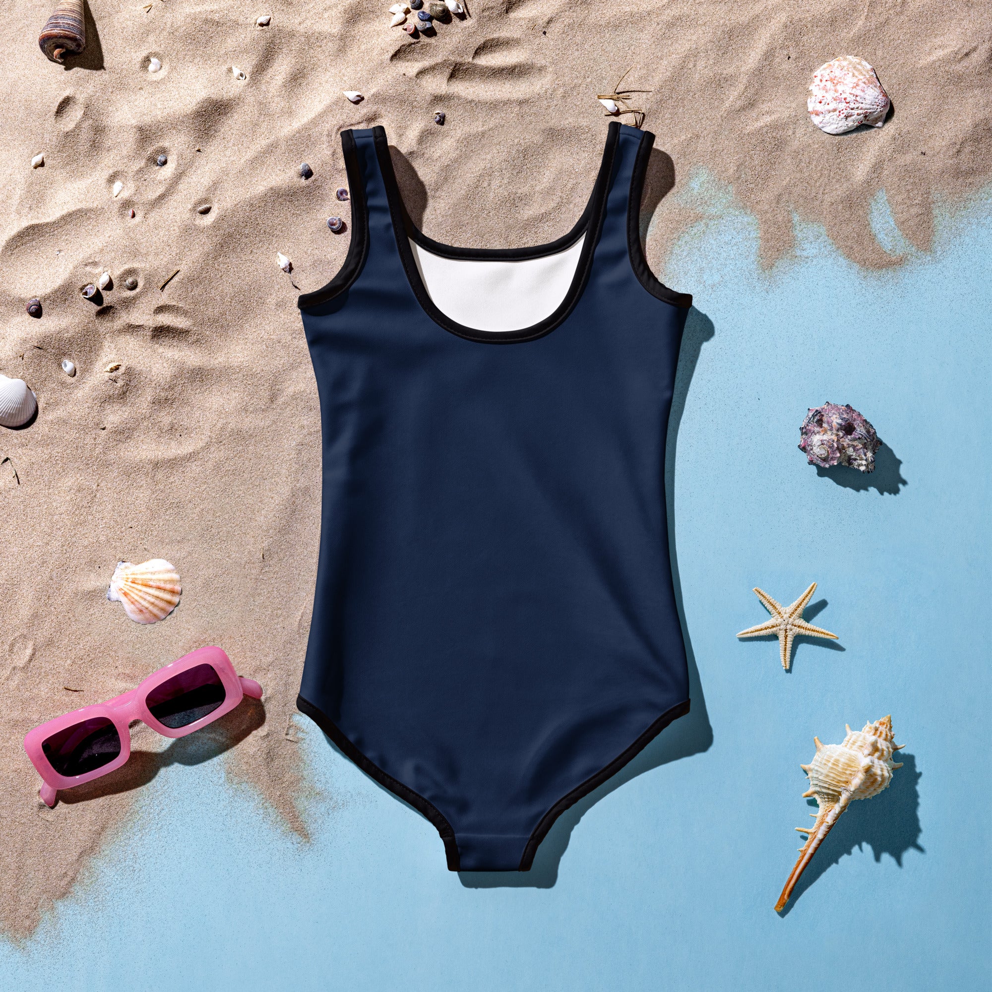 Girls navy blue buttery soft one-piece swimsuit with black trim white lining and UPF 50 plus sun protection